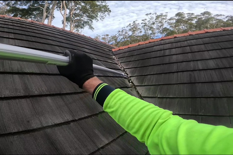 
Employing extended poles for meticulous gutter cleaning, leaving clean valleys on steep roofs in portstephens