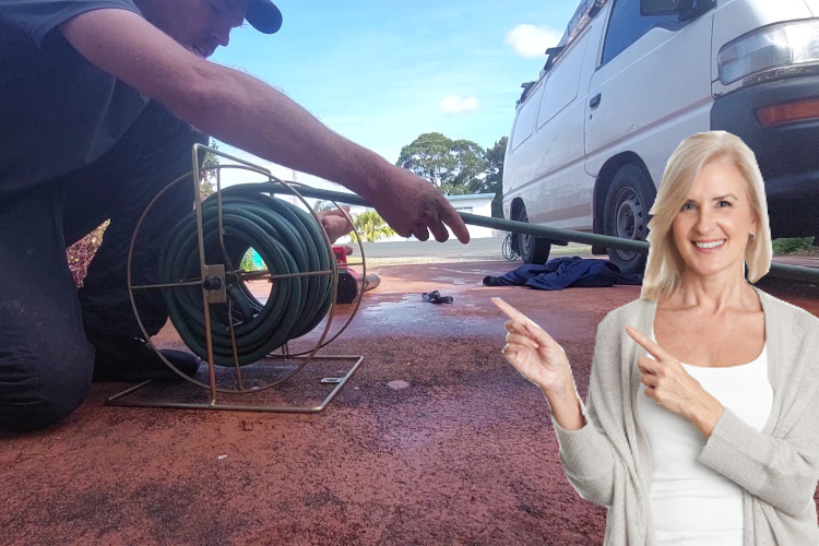 
A hose is carefully stored as a portstephens gutter cleaner finishes up a day of rinsing.